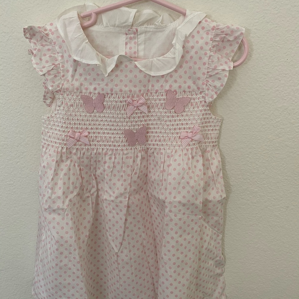 pink dotty dress with butterfly details